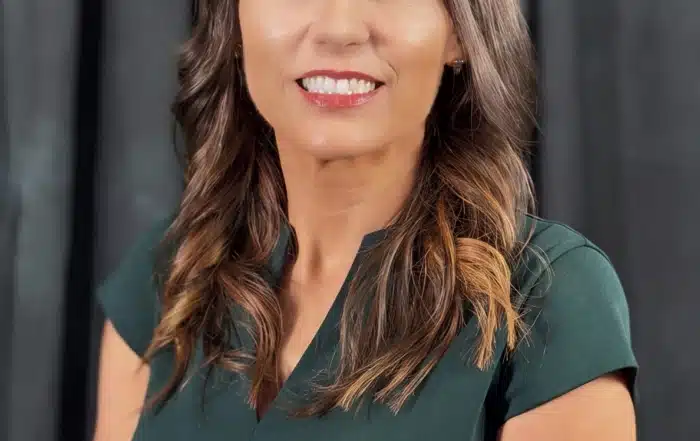 A professional headshot of Jodi Conachen