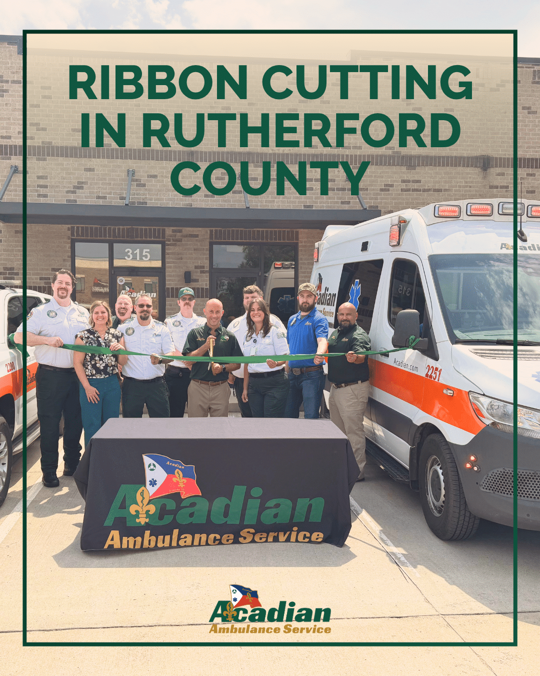 Acadian Ambulance Tennessee team members cut a green ribbon in front of Acadian's new station in Rutherford County.